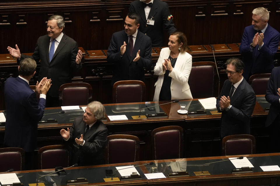 Italian Premier Mario Draghi, top left, leaves at the end of his address at the Parliament in Rome, Thursday, July 21, 2022. Premier Mario Draghi's national unity government headed for collapse Thursday after key coalition allies boycotted a confidence vote, signaling the likelihood of early elections and a renewed period of uncertainty for Italy and Europe at a critical time. (AP Photo/Andrew Medichini)