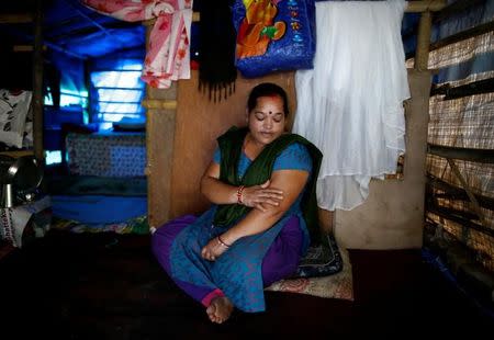Shanti Pariyar, 42, sits inside her makeshift shelter as she speaks during an interview at Chuchepati in Kathmandu, Nepal, September 19, 2016. Thomson Reuters Foundation/Navesh Chitrakar
