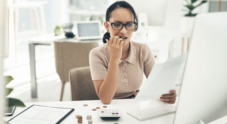 A woman reviewing here MAGI before filing her taxes.