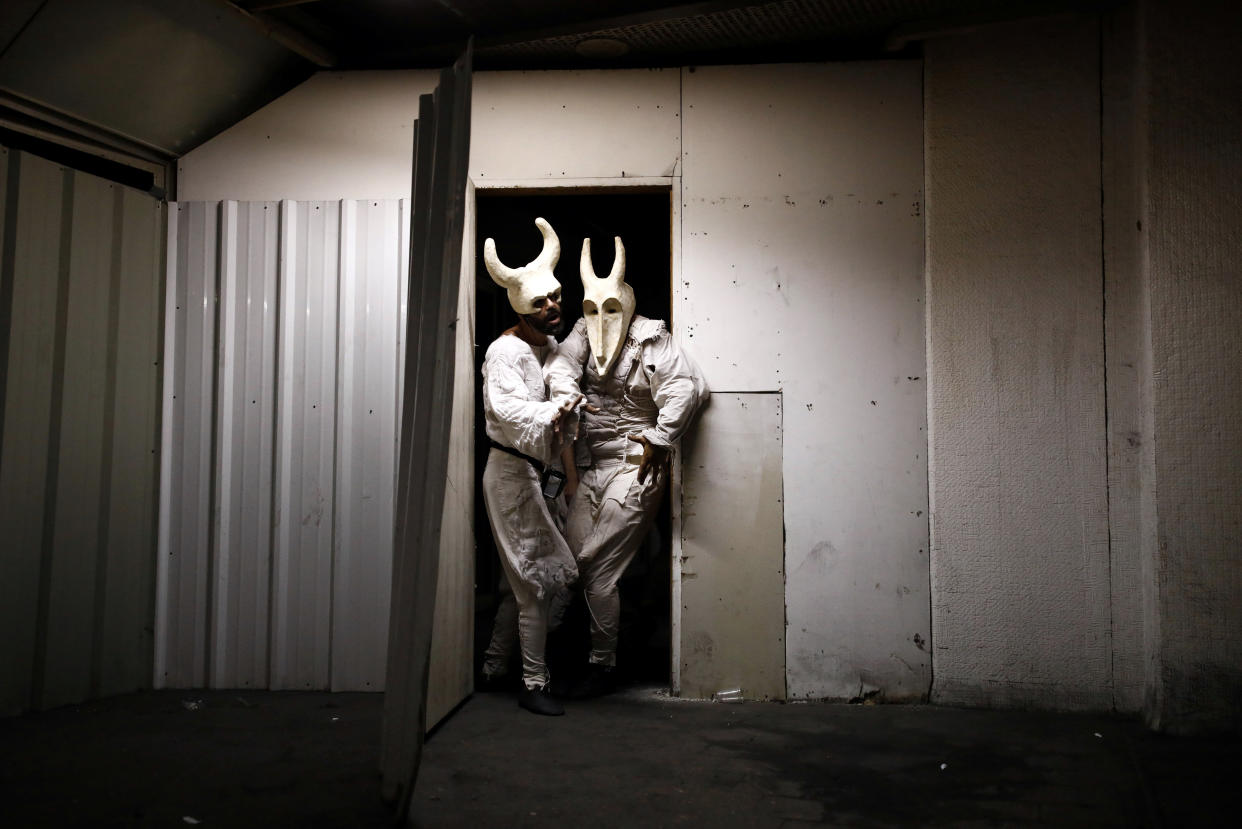 Lior Avshalem and Rotem Cohen, actors from the Mystorin Theatre Ensemble, perform in the group's show "Seven," at the Central Bus Station in Tel Aviv, Israel, on May 25. (Photo: Corinna Kern/Reuters)