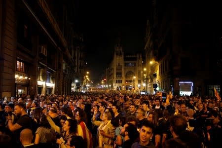Demonstrators attend a protest after a verdict in a trial over a banned independence referendum, in Barcelona