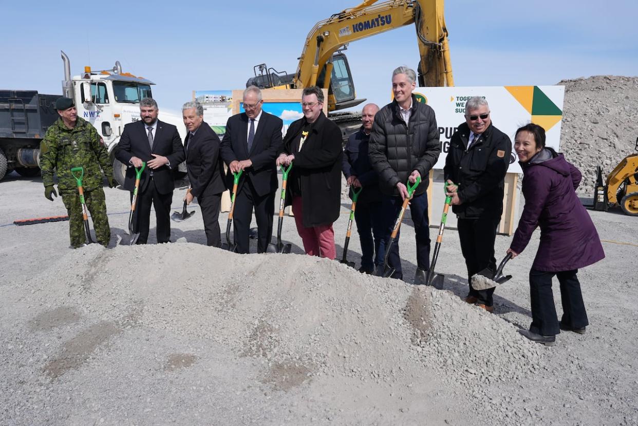 Northern Affairs Minister Dan Vandal, 3rd from left, and Department of National Defence Minister Bill Blair, 4th from left, attended the groundbreaking ceremony on Wednesday for a new national defence facility in Yellowknife. Construction is set to begin next month. (Julie Plourde/Radio-Canada - image credit)