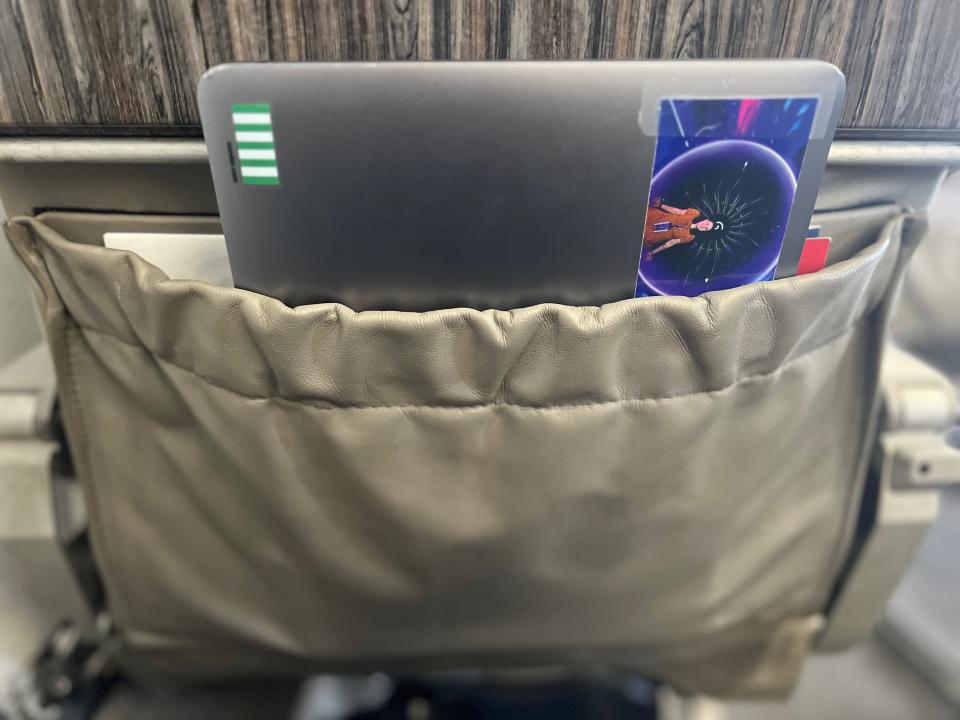 The author's laptop in the seatback pocket.