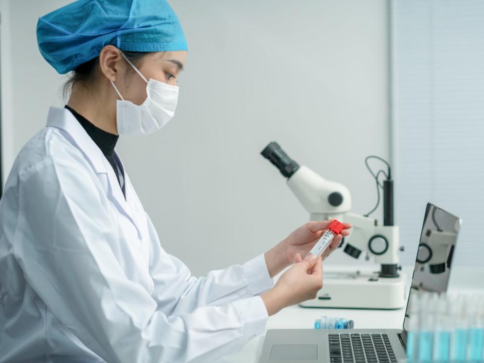 Scientist or doctor holding a test tube