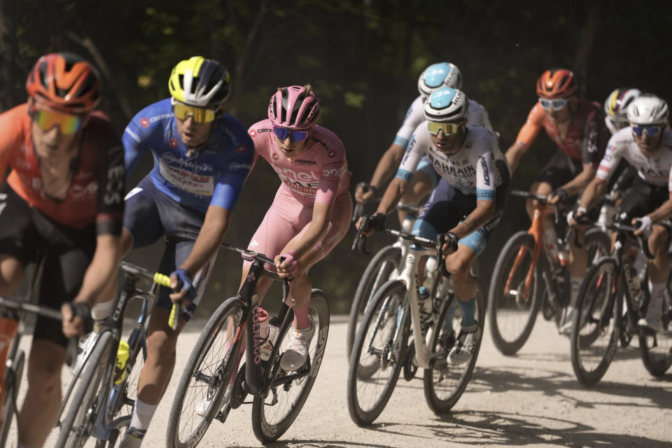 Slovenia's Tadej Pogacar, third from left, wearing the pink jersey of the race overall leader, pedals during the sixth stage of the of the Giro d'Italia, Tour of Italy cycling race from Viareggio to Rapolano Terme, Thursday, May 9, 2024. (Fabio Ferrari/LaPresse via AP)