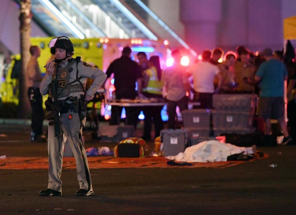 A Las Vegas Metropolitan Police officer stands near the scene of a mass shooting at a country music festival (Ethan Miller/Getty Images)