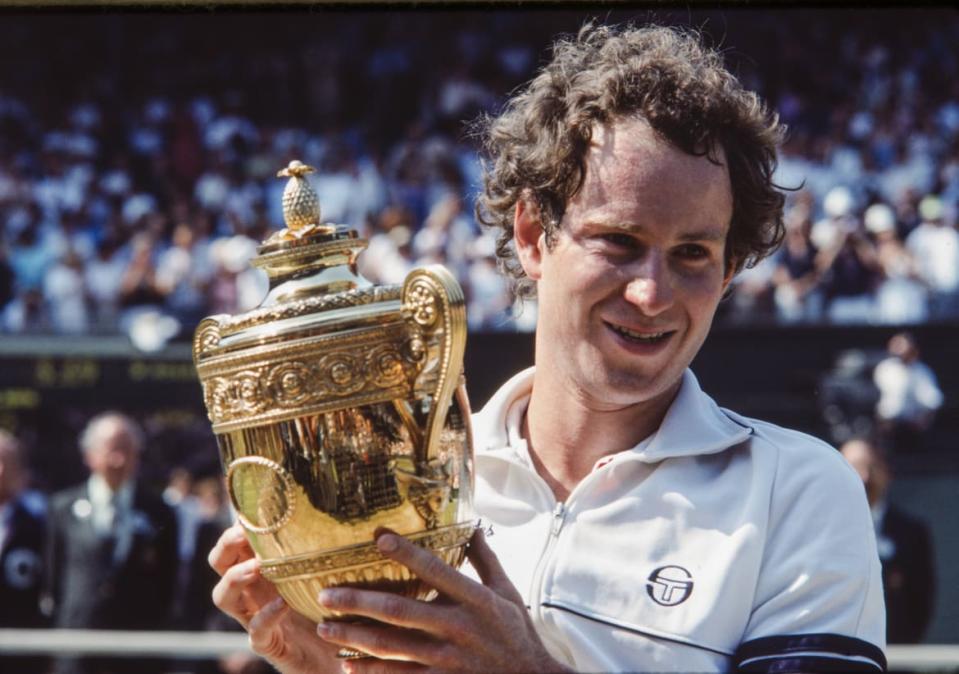 <div class="inline-image__caption"><p>John McEnroe holding the Gentlemen’s Singles Final Trophy at The Championships 1983 at The All England Lawn Tennis Club, Wimbledon.</p></div> <div class="inline-image__credit">Michael Cole/AELTC/Showtime</div>