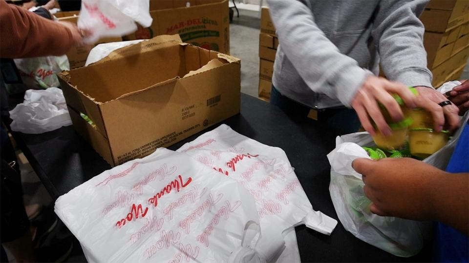 Food packers fill boxes at the York County Food Bank.