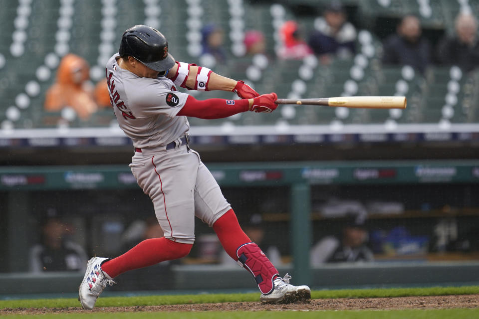 Boston Red Sox's Enrique Hernandez hits a one-run double against the Detroit Tigers in the fourth inning of a baseball game in Detroit, Wednesday, April 13, 2022. (AP Photo/Paul Sancya)