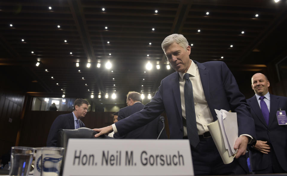 Supreme Court Justice nominee Neil Gorsuch return from a break to continue his testimony on Capitol Hill in Washington, Wednesday, March 22, 2017, during his confirmation hearing before the Senate Judiciary Committee. (AP Photo/Susan Walsh)