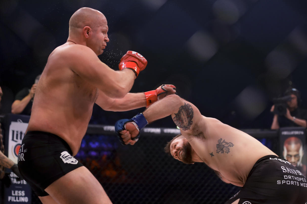 Ryan Bader (R) became Bellator’s first dual champion with his knockout of Fedor Emelianenko at Bellator 214 on Saturday. (AP Photo/Chris Carlson)