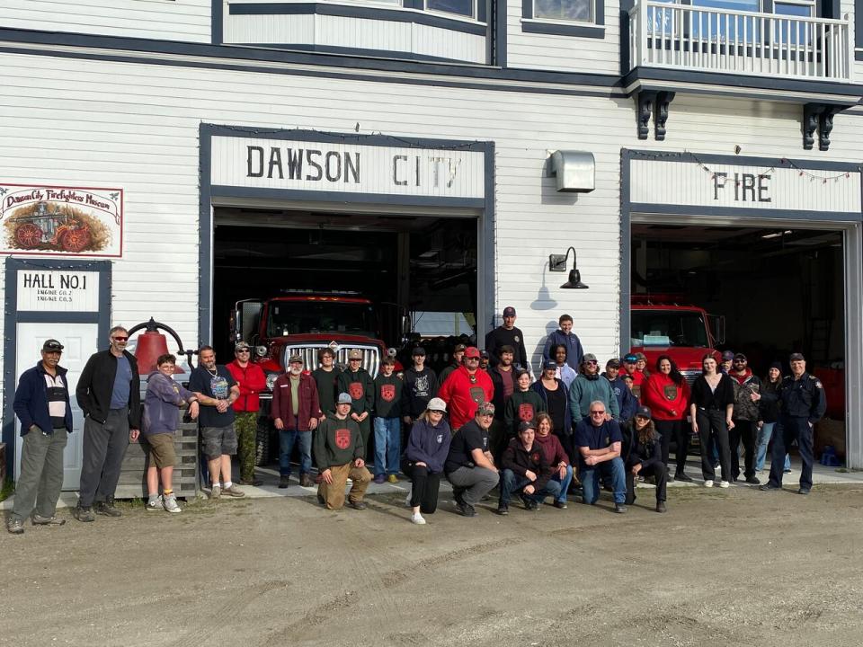 The group of local emergency responders infront of Dawson City's fire hall. The group filled 1000 emergency information kits in only acouple of hours.