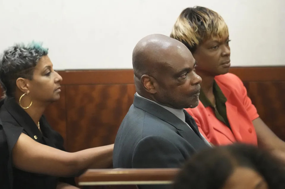 Former Houston police officer Gerald Goines, center, waits with family members for the jury to return to the 482nd District Court at the Harris County Criminal courthouse for the verdict in his murder trial, Wednesday, Sept. 25, 2024, in Houston (Melissa Phillip/Houston Chronicle via AP)