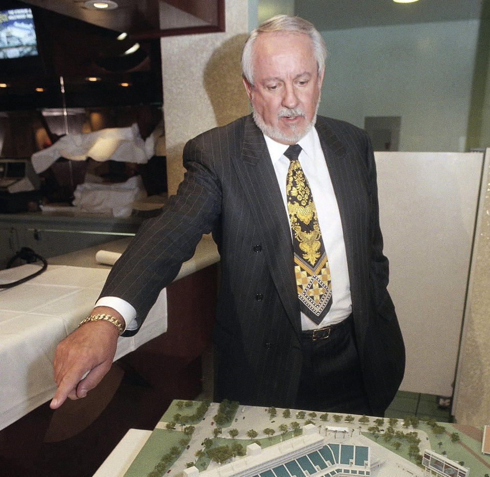 FILE - In this Dec. 8, 1995, file photo, Hollywood Park Chairman and Chief Operating Officer R.D. Hubbard shows off a model of a proposed NFL stadium to be built on Hollywood Park's property adjacent to the existing race track following a news conference in Inglewood, Calif. Hubbard, who bred, owned and raced thoroughbred and quarter horses, and was an influential executive in the racing industry, has died. He was 84. (AP Photo/Chris Pizzello)