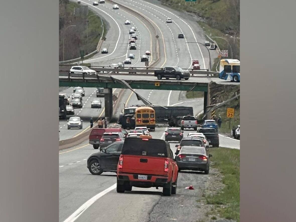 A photo from the Bedford Talk Facebook group shows where the tractor-trailer fell from the overpass onto Highway 102 on May 16. Nova Scotia RCMP say there were no reports of injuries. (Talk Bedford/Facebook - image credit)