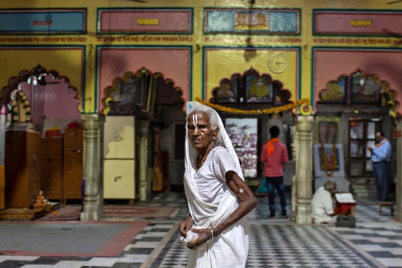 A Hindu devotee leaves after evening prayers at a temple in Ayodhya