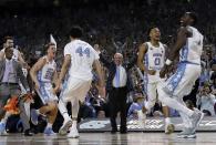 <p>North Carolina head coach Roy Williams and players celebrate after the finals of the Final Four NCAA college basketball tournament against Gonzaga, Monday, April 3, 2017, in Glendale, Ariz. North Carolina won 71-65. (AP Photo/David J. Phillip) </p>