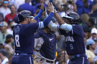 Chicago Cubs' Christopher Morel, right, celebrates with Ian Happ after hitting a two-run home run during the sixth inning of a baseball game against the Milwaukee Brewers in Chicago, Friday, Aug. 19, 2022. (AP Photo/Nam Y. Huh)