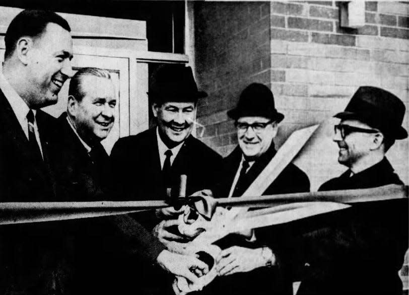 Barberton Mayor Kenneth Cox helps with a ribbon-cutting ceremony at Barberton Plastics on Robinson Avenue on March 1, 1966. From left: R. Bruce Miller, Ohio Gov. Jim Rhodes, state Sen. Ed Garrigan, Larry Armour and Cox.