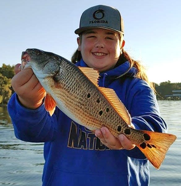 Dayton Blake, 14, of Bartow, caught this redfish, his very first red, while fishing the St. Johns River near Green Cove Springs recently.