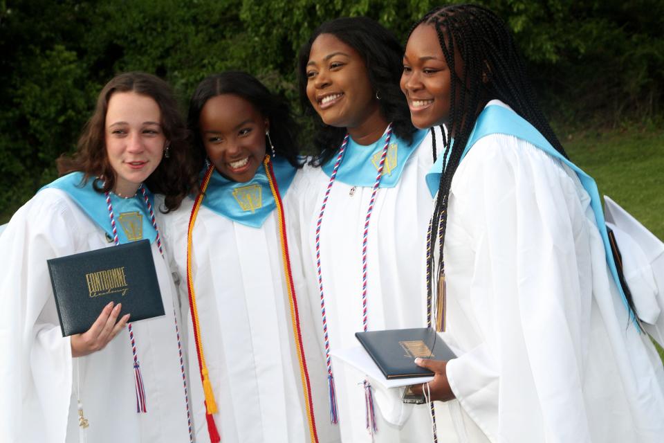 Ava Petrosino, Kamilah Deslouches, Tiffany Nigige and Esosasehia Owens pose for a photo after the Fontbonne Academy graduation ceremony on Thursday, May 26, 2022