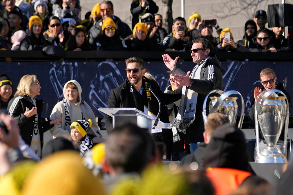 Dec 12, 2023; Columbus, OH, USA; Columbus Crew president Tim Bezbatchenko (left) and owner JW Johnson celebrate their 2023 MLS Cup victory in Chase Plaza outside of Lower.com Field.