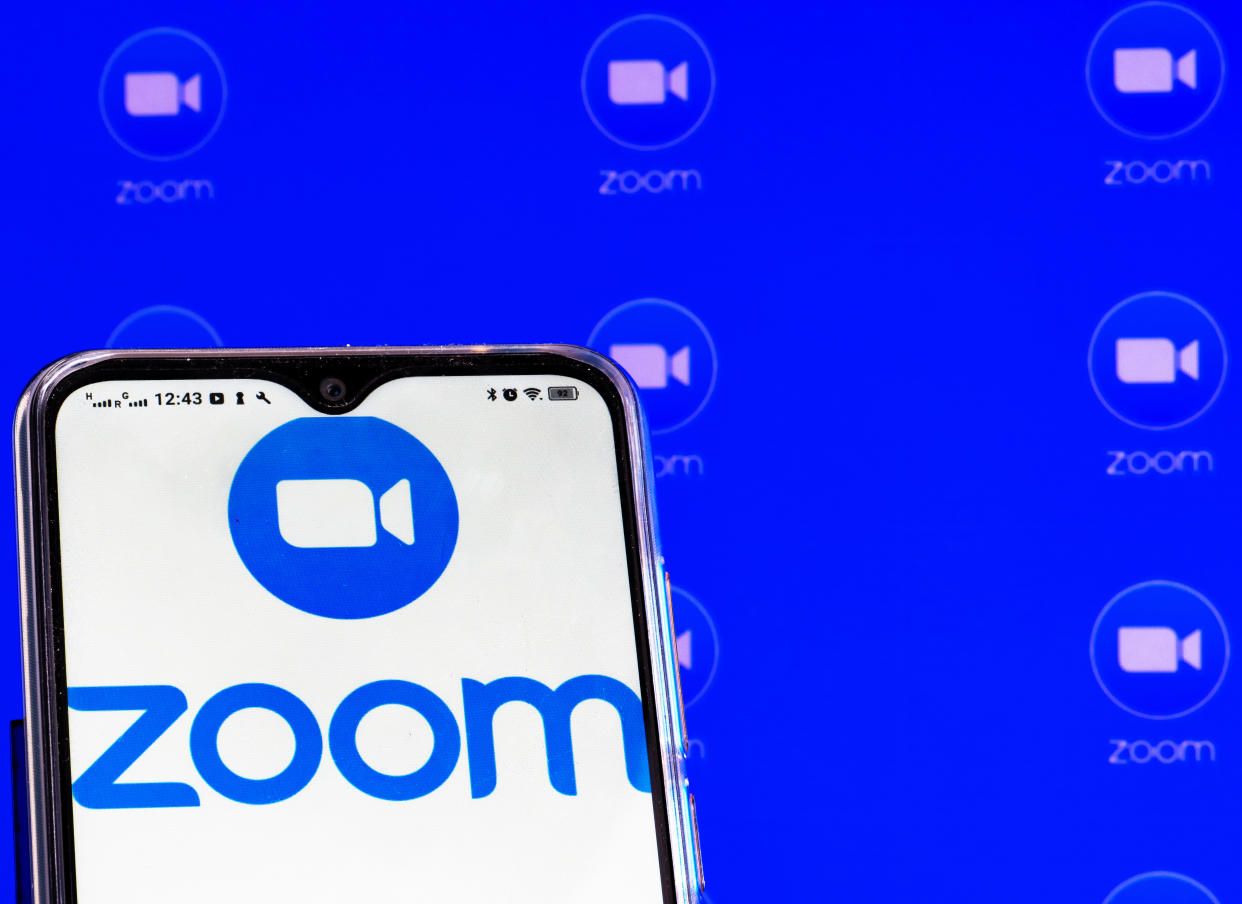 UKRAINE - 2021/02/01: In this photo illustration a Zoom Video Communications, Inc. logo is seen displayed on a smartphone screen. (Photo Illustration by Igor Golovniov/SOPA Images/LightRocket via Getty Images)