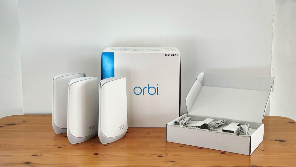 Netgear Orbi RBK763 on a wooden table