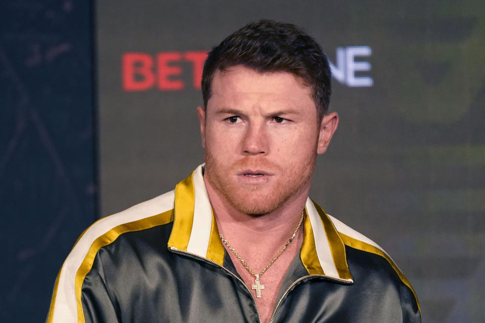 Boxer Canelo Alvarez of Mexico listens during a pre-fight news conference, Thursday, May 6, 2021, in Arlington, Texas. Alvarez fights Billy Joe Saunders on Saturday, May 8, 2021, for the unified super middleweight world championship. (AP Photo/LM Otero)