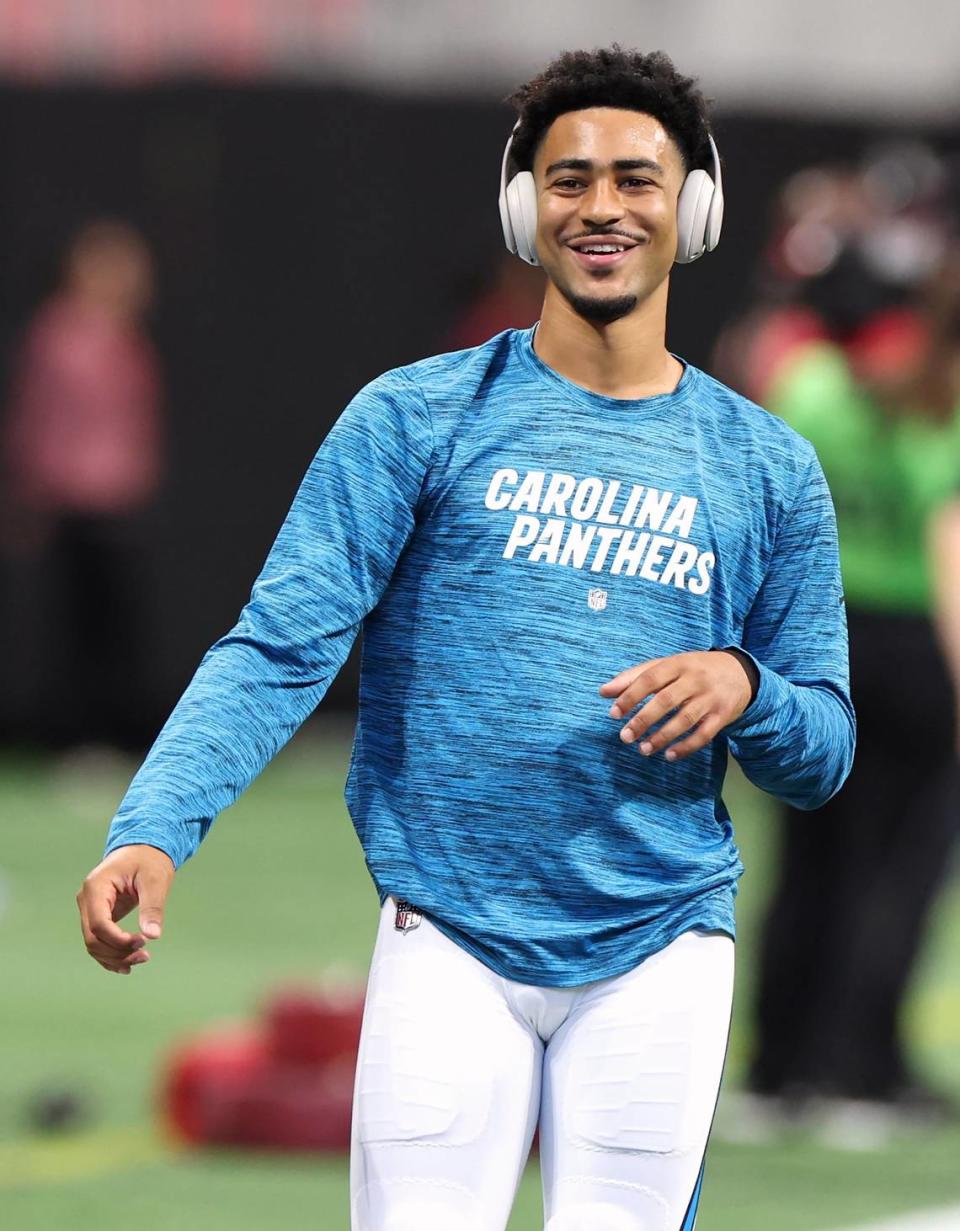 Carolina Panthers rookie quarterback Bryce Young smiles as he throws passes during a pregame workout at Mercedes-Benz Stadium in Atlanta, GA on Sunday, September 10, 2023. Young and the Panthers open the NFL season against the Atlanta Falcons.