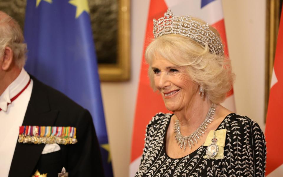 Camilla wore a black evening dress with silver embroidery by Bruce Oldfield and the Boucheron diamond tiara - Andreas Rentz
