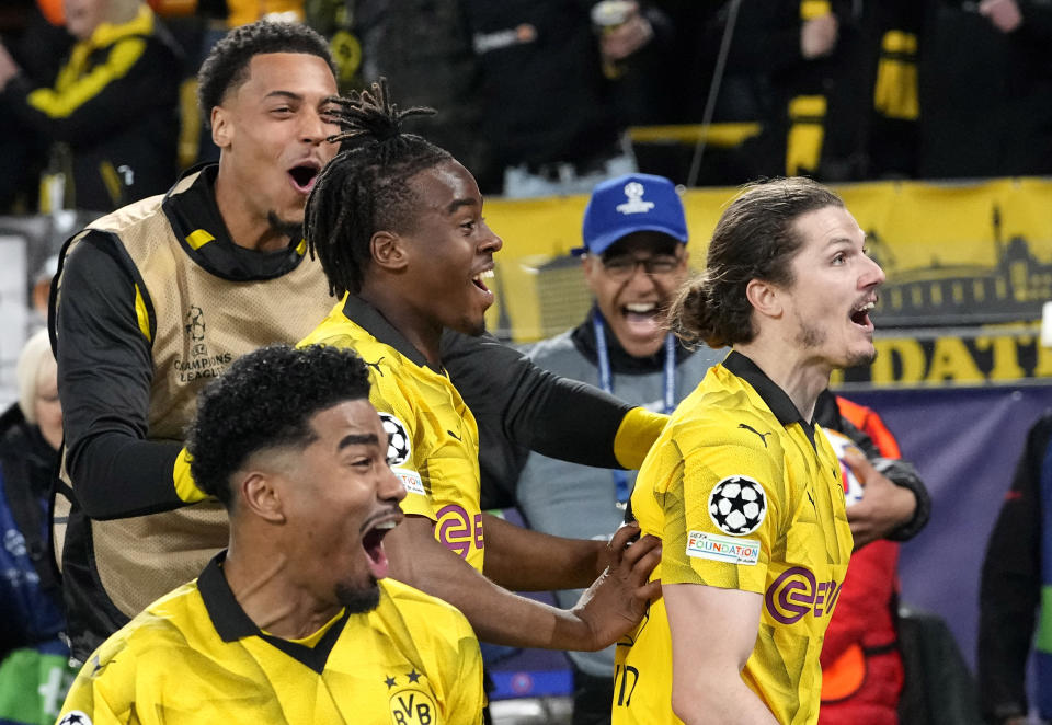 Dortmund's Marcel Sabitzer, right, celebrates his side's 4th goal during the Champions League quarterfinal second leg soccer match between Borussia Dortmund and Atletico Madrid at the Signal-Iduna Park in Dortmund, Germany, Tuesday, April 16, 2024(AP Photo/Martin Meissner)