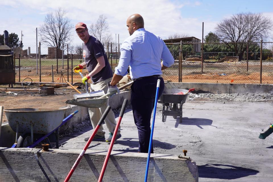 U.S. Rep Colin Allred volunteers cleaning up Sunday in Fritch following the aftermath of Texas wildfires in Fritch.