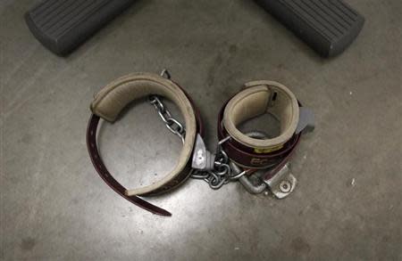 An ankle shackle used by prisoners is seen on the floor of the conference room at Camp VI, a prison used to house detainees at the U.S. Naval Base at Guantanamo Bay