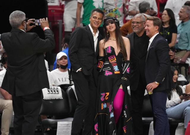 She wears ballgowns to the Miami Heat's home games. So, who is