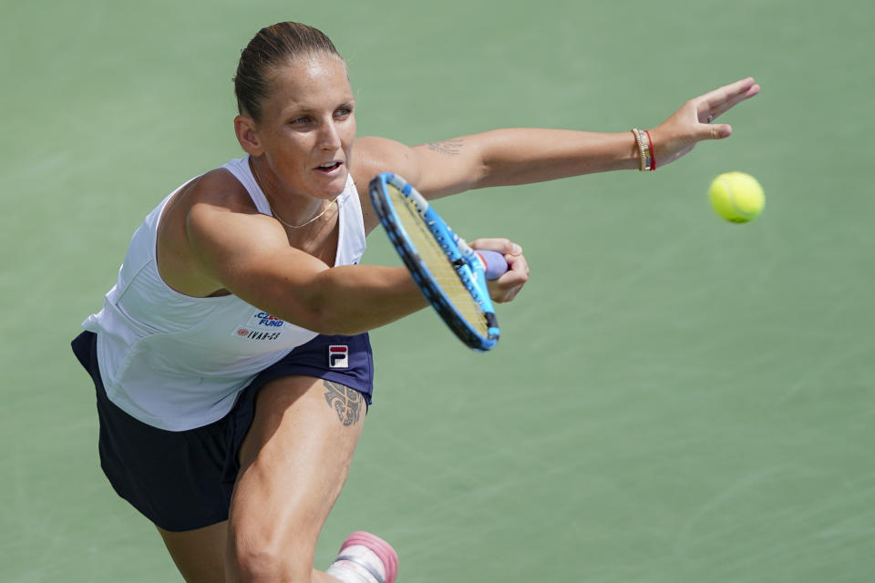 FILE - In this Aug. 16, 2019, file photo, Karolina Pliskova, of the Czech Republic, returns to Svetlana Kuznetsova, of Russia, during the Western & Southern Open tennis tournament in Mason, Ohio. Pliskova is ranked No. 3 entering the U.S. Open, where she was the runner-up in 2016. (AP Photo/John Minchillo, File)