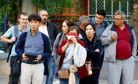 Supporters of U.S. pastor Andrew Brunson wait near his house in Izmir, Turkey October 12, 2018. REUTERS/Osman Orsal