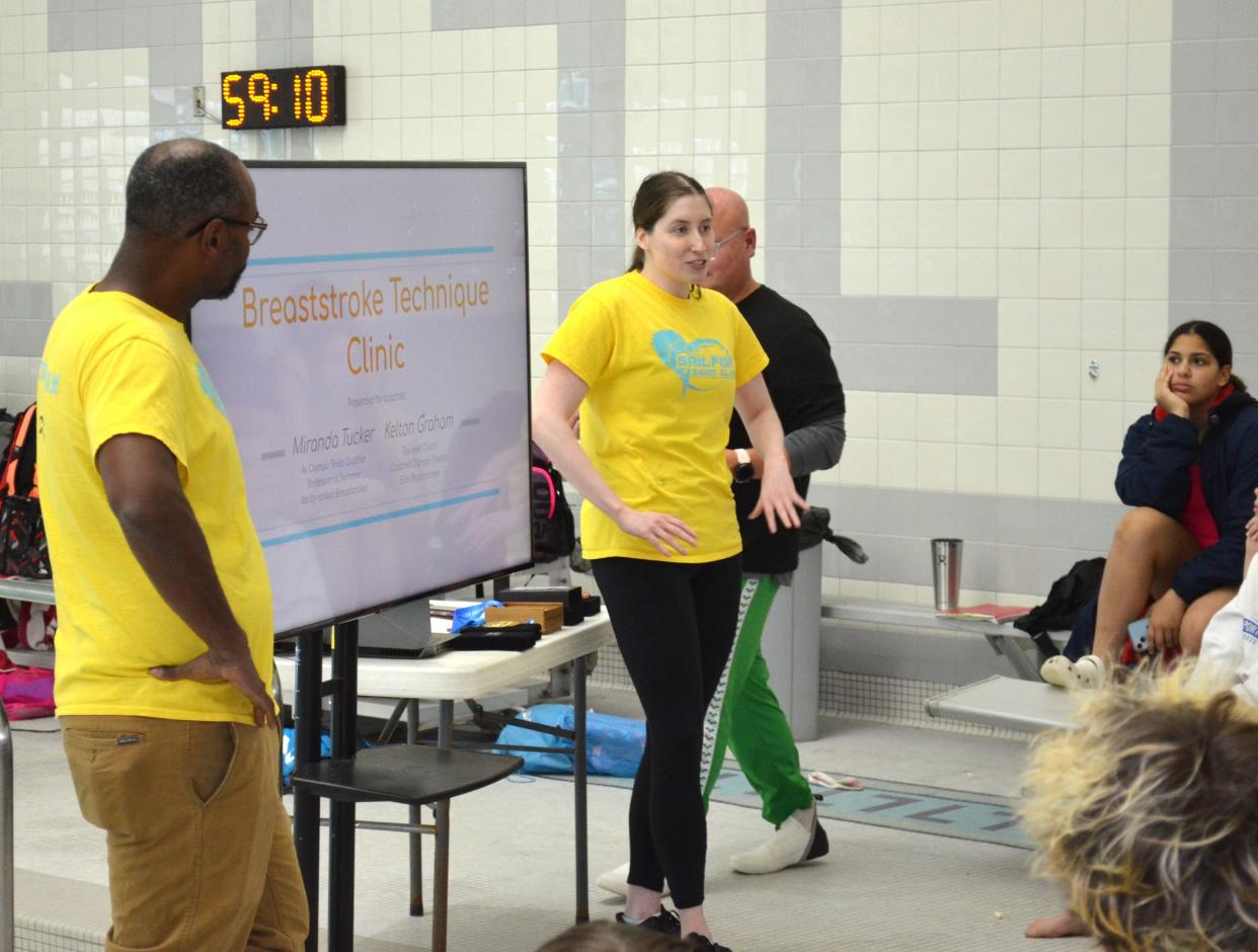 Miranda Tucker, a former University of Michigan swim standout, Big Ten champion and Olympic Trials qualifier, speaks to a group of youth swimmers at the Sunshine Toyota Stroke Clinic at Lakeview High School on Saturday.