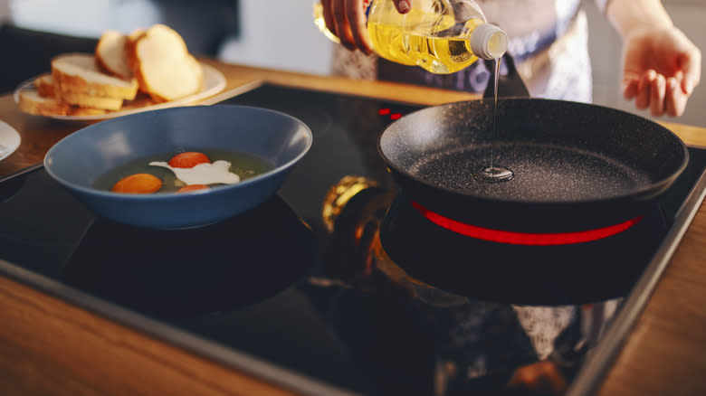 Filling pan with oil on stovetop