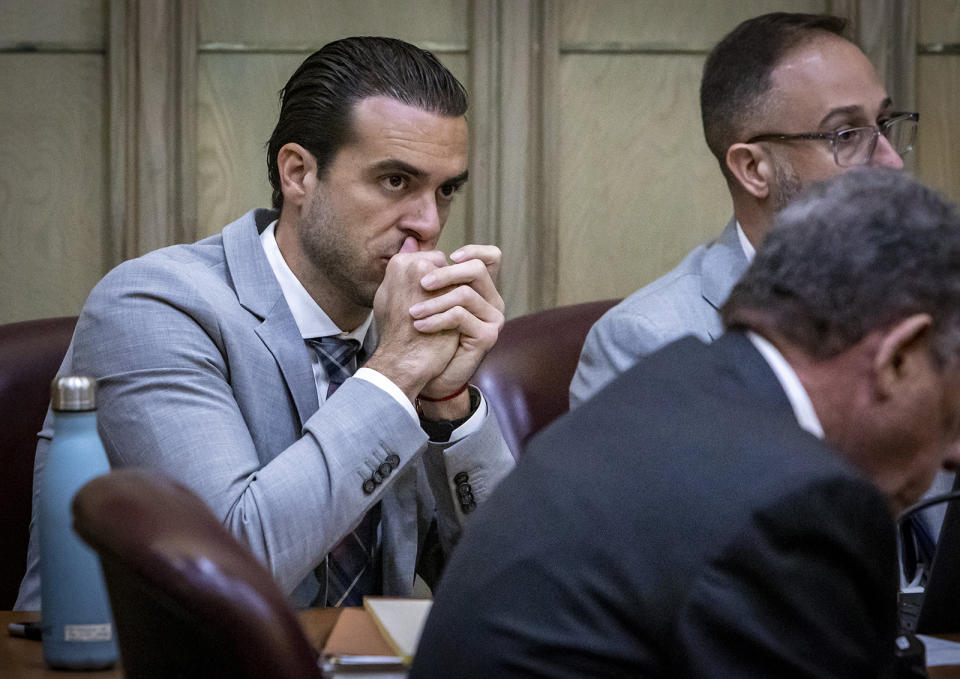 Pablo Lyle, left, sits along with his attorneys during pre-trial motions in Miami-Dade Criminal Court on Thursday, Sept. 22, 2022, in Miami, Florida. Lyle is accused of killing 63-year-old Juan Ricardo Hernandez during a road rage incident in 2019. (Jose A. Iglesias/Miami Herald/Tribune News Service via Getty Images)