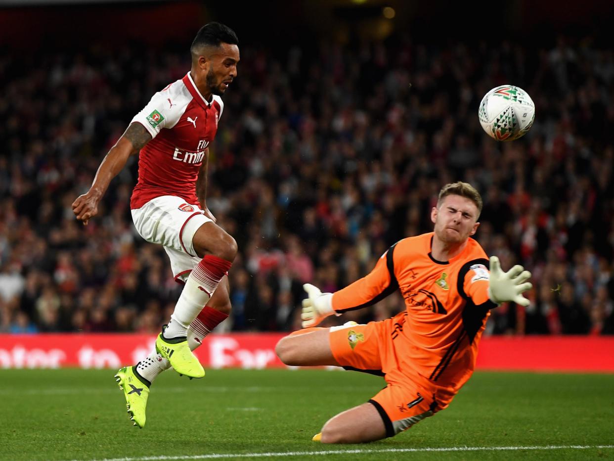 Theo Walcott opens the scoring for Arsenal: Getty Images