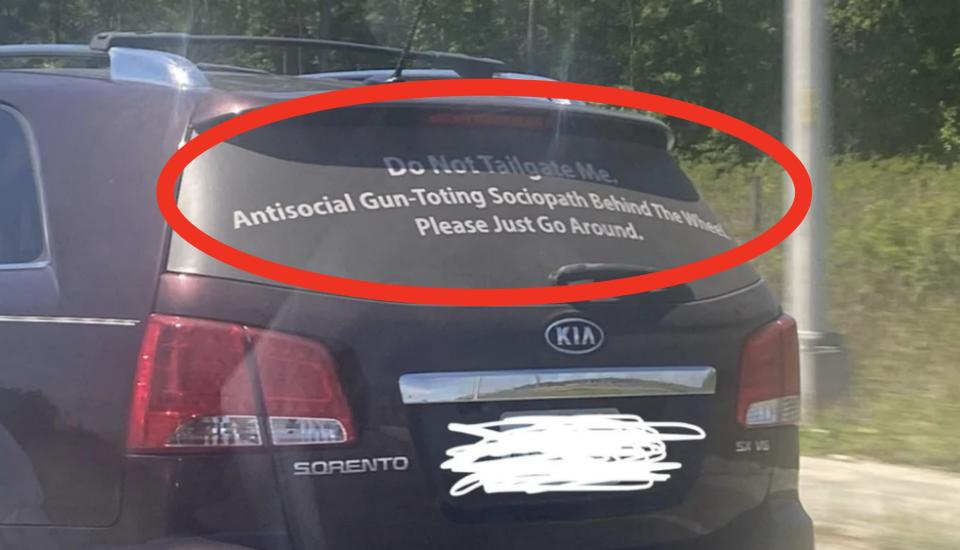 Rear view of a Kia Sorento with a bumper sticker reading: "Do Not Tailgate Me. Antisocial Gun-Toting Sociopath Behind The Wheel. Please Just Go Around."