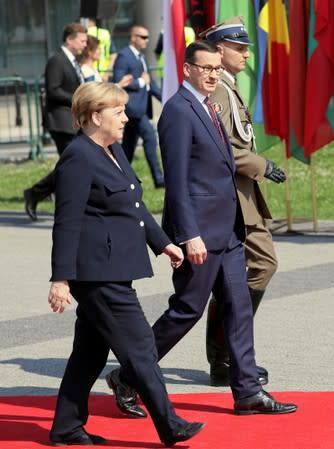 Poland's Prime Minister Morawiecki and Germany's Chancellor Merkel attend a ceremony to mark the anniversary of the outbreak of World War Two in Warsaw