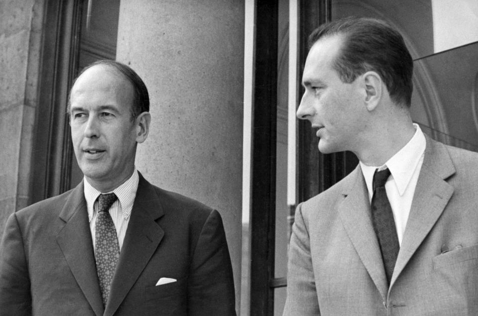 As finance minister, left, with Jacques Chirac leaving the Elysee Palace in 1969 - AP