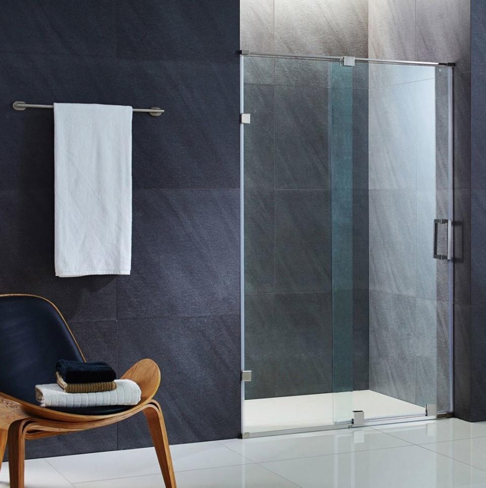 dark wall with sliding glass shower doors