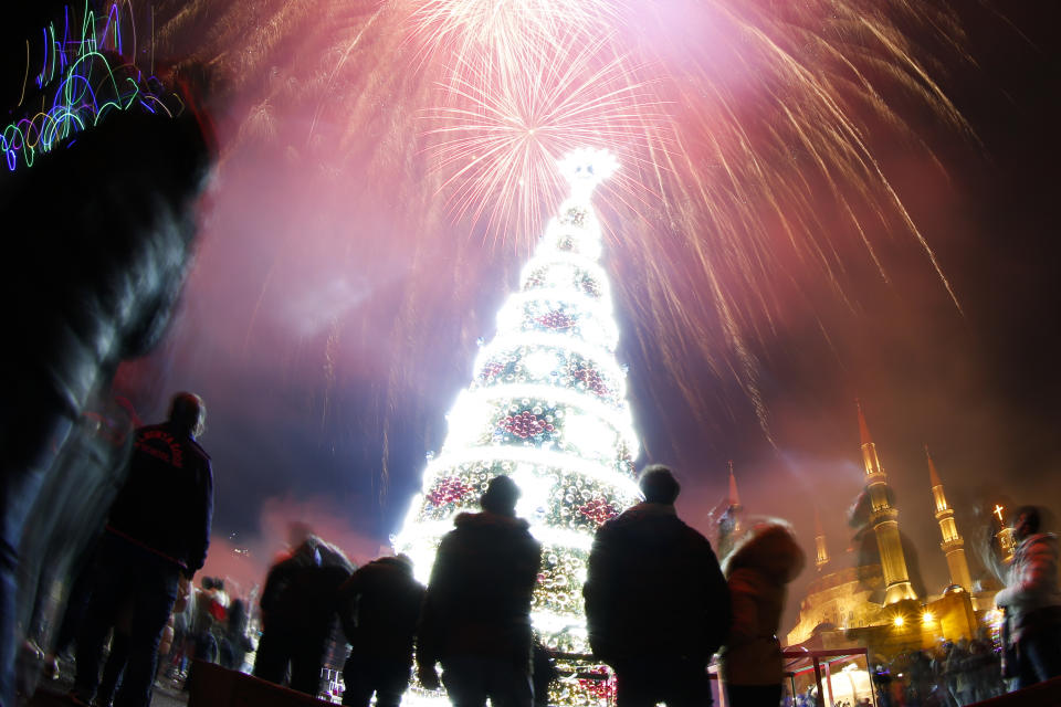 Fireworks explode over Martyrs Square during New Year's Day, in downtown Beirut, Lebanon, Tuesday, Jan. 1, 2019. (AP Photo/Hassan Ammar)