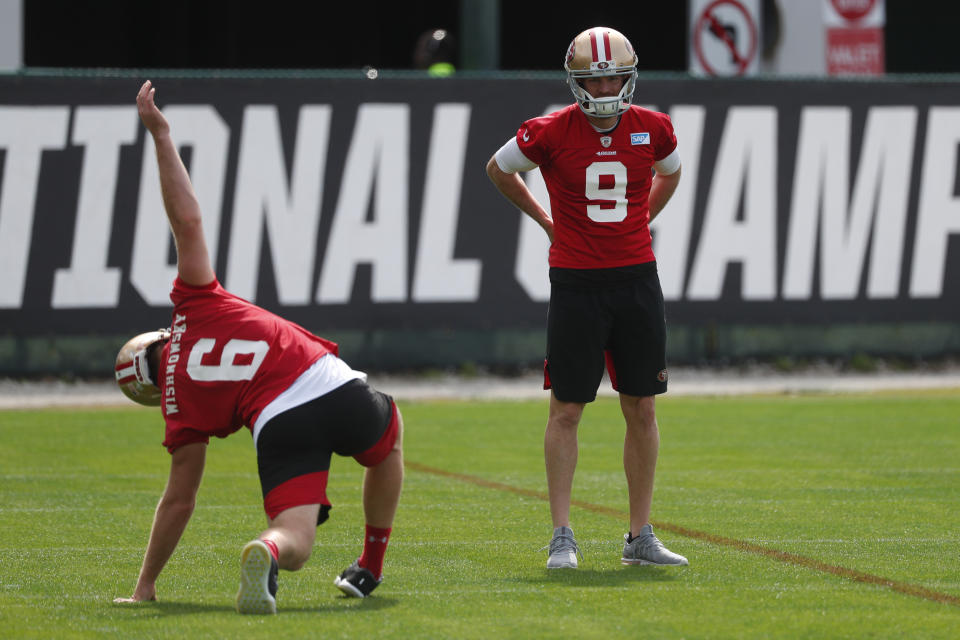 San Francisco 49ers punter Mitch Wishnowsky (6) and kicker Robbie Gould (9) stretch during practice for the NFL Super Bowl 54 football game, Friday, Jan. 31, 2020, in Coral Gables, Fla. (AP Photo/Wilfredo Lee)