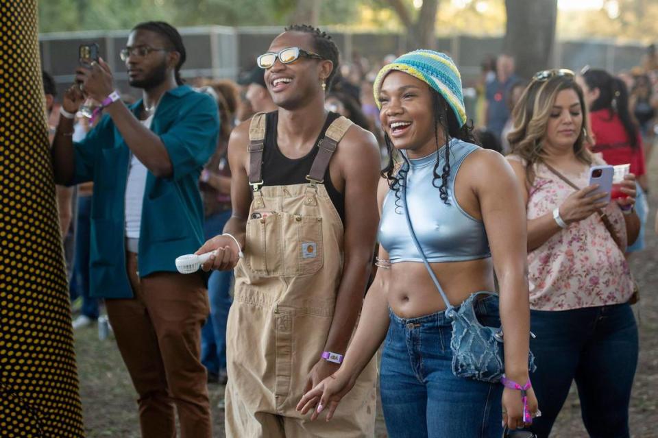 Austin Watts and his sister Asia Watts, of Santa Clarita, laugh as singer Sabrina Claudio performs on the first day of the Sol Blume R&B festival on Saturday.