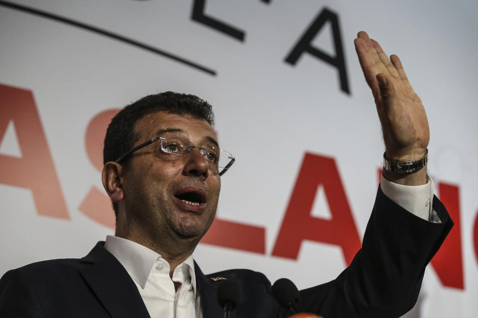 Ekrem Imamoglu, the candidate from an alliance led by the secular Republican People's Party, (CHP) gestures as he declares victory during a news conference in Istanbul, Monday April 1, 2019.Unofficial results by state-run Anadolu news agency said he had won 48.8 percent of the vote Sunday and his opponent, former Prime Minister Binali Yildirim of the ruling party, had captured 48.5 percent. One percent of the votes were still to be counted. (AP Photo/Emrah Gurel)