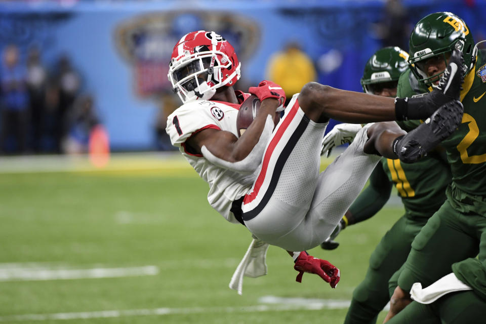 Georgia wide receiver George Pickens (1) is upended by Baylor linebacker Blake Lynch (2) during the first half of the Sugar Bowl NCAA college football game in New Orleans, Wednesday, Jan. 1, 2020. (AP Photo/Bill Feig)